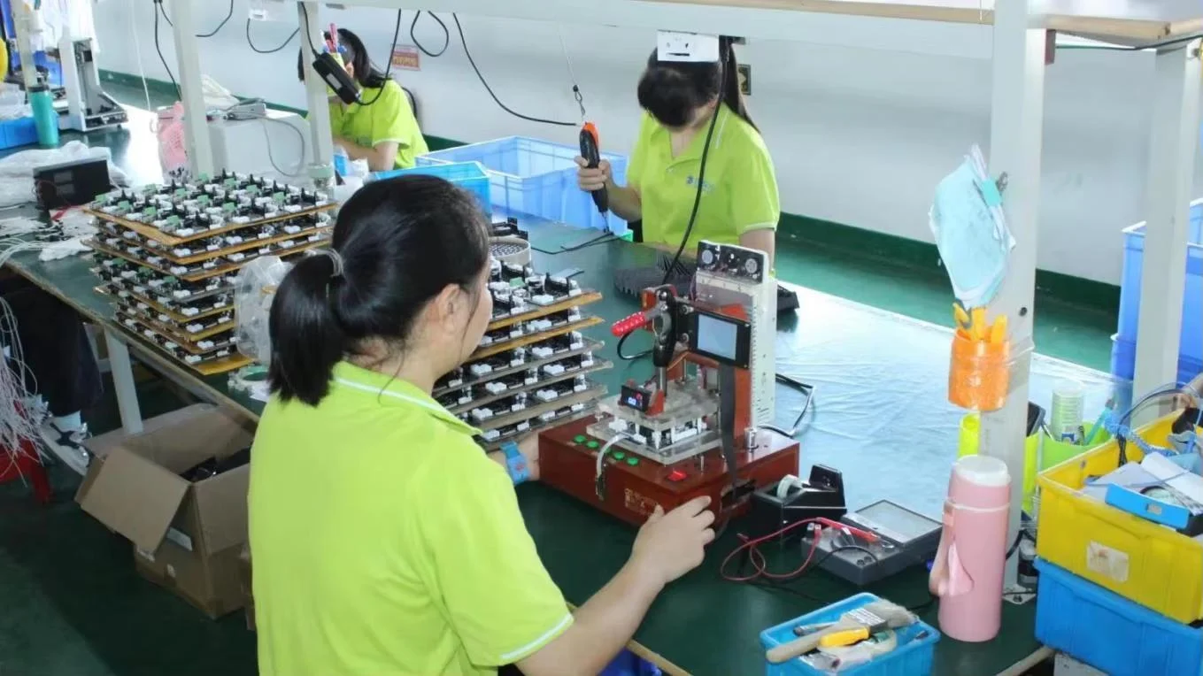 PCBA testing station — mainboard flashed and tested in-line