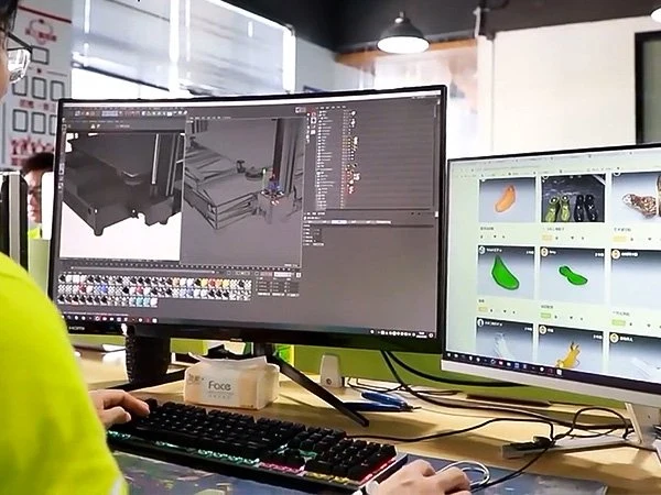 R&D engineering desk with CAD workstation in the workshop